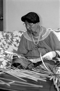 Marian Bowers making a palmetto stem basket - Brighton Seminole Indian Reservation, Florida.
