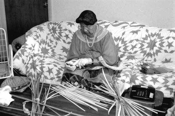 Marian Bowers making a palmetto stem basket - Brighton Seminole Indian Reservation, Florida.
