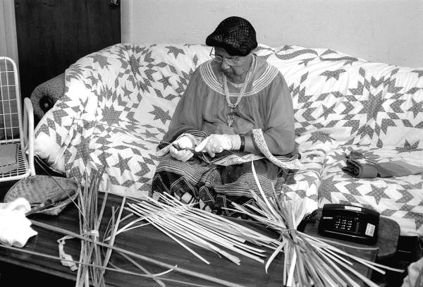 Marian Bowers making a palmetto stem basket - Brighton Seminole Indian Reservation, Florida.