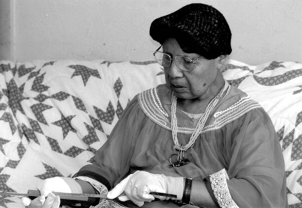 Marian Bowers making a palmetto stem basket - Brighton Seminole Indian Reservation, Florida.