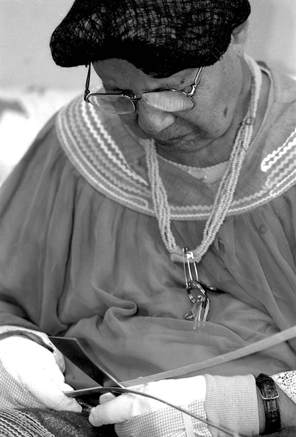 Marian Bowers making a palmetto stem basket - Brighton Seminole Indian Reservation, Florida.