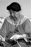 Marian Bowers making a palmetto stem basket - Brighton Seminole Indian Reservation, Florida.