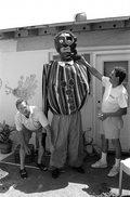 Isaac Duenas (L) and apprentice Ramon Zepeda putting finishing touches on a gigante to be used in festival - North Miami Beach, Florida.
