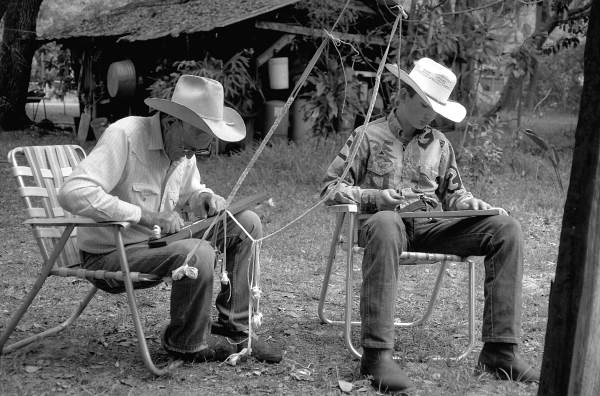 Cow whip maker George "Junior" Mills (l) and his apprentice J. Taylor Marcus working - Okeechobee, Florida.