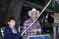 Cow whip maker George "Junior" Mills (r) and his apprentice J. Taylor Marcus working - Okeechobee, Florida.