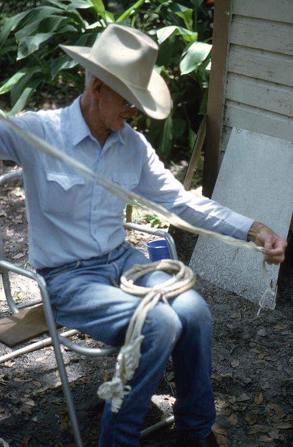 Cow whip maker George "Junior" Mills working on whip - Okeechobee, Florida.