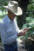 Cow whip maker George "Junior" Mills plaiting a whip - Okeechobee, Florida.