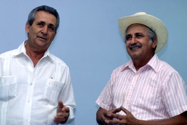 Cuban guajiro singer Meliton Perdomo, right, listens as his apprentice, Mario Brito, sings a decima - Medley, Florida.