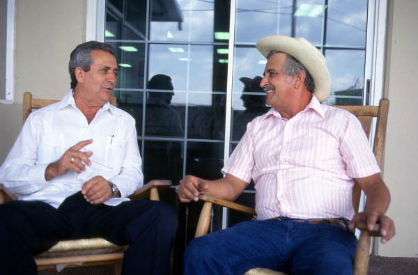 Cuban guajiro apprentice, Mario Brito, left, sings a decima to Meliton Perdomo - Medley, Florida.