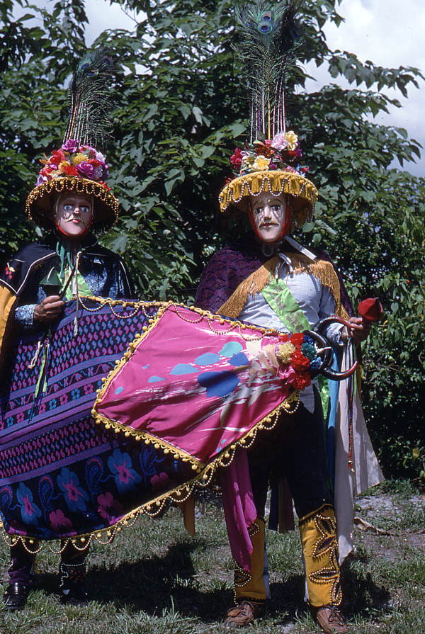 Jose Silva, right, and his apprentice Marvin Silva wearing the mandador costumes and holding the bull mask of the Nicaraguan Toro Huaco pageant.