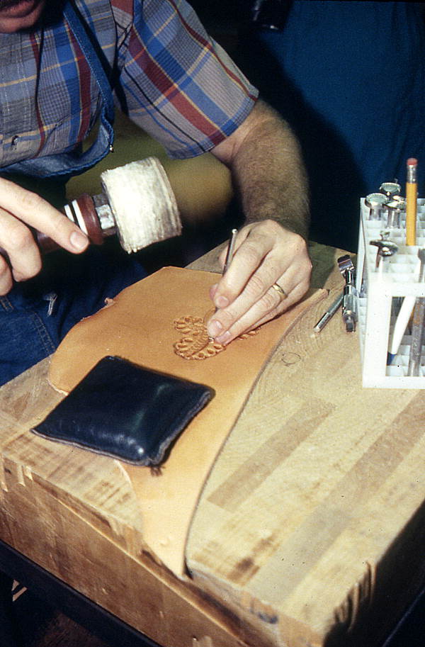 Saddlemaker Perry McLelland tooling leather with die and mallet - Lake Worth, Florida.