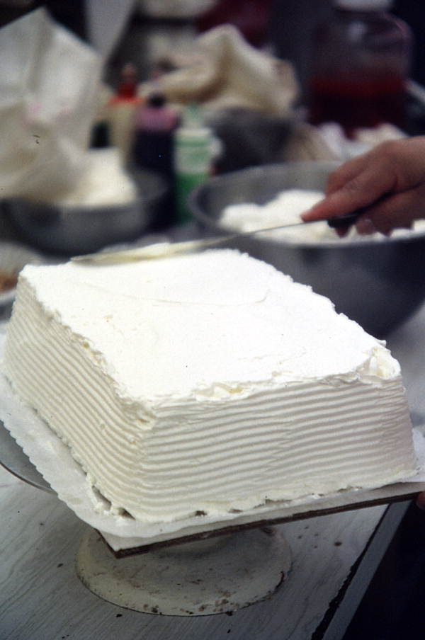 Frosting cake with whipped cream - Lake Worth, Florida