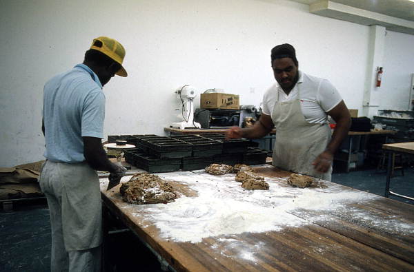Jamroc Bakery employees slicing bread dough mixture - Belle Glade, Florida.