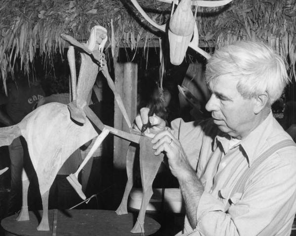 Paul Greene of Cocoa carving wood figurine at the 1978 Florida Folk Festival - White Springs, Florida
