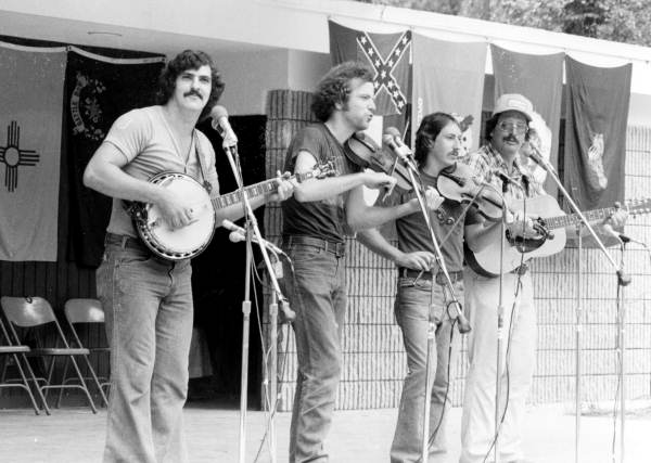 From left, Pat Shields, John McCutcheon, and the Rogers Brothers performing at the 1976 Florida Folk Festival - White Springs, Florida.