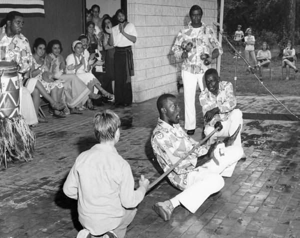 The Junkanoos, Bahamian folk group from Key West, performing limbo dance at the 1977 Florida Folk Festival - White Springs, Florida