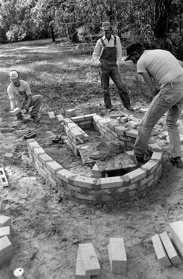 Terry Hill, Horace Temples, and Ted Temples constructing cane furnace at the Stephen Foster State Folk Culture Center - White Springs, Florida.