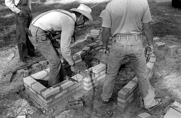 Terry Hill, Horace Temples, and Ted Temples constructing cane furnace at the Stephen Foster State Folk Culture Center - White Springs, Florida.