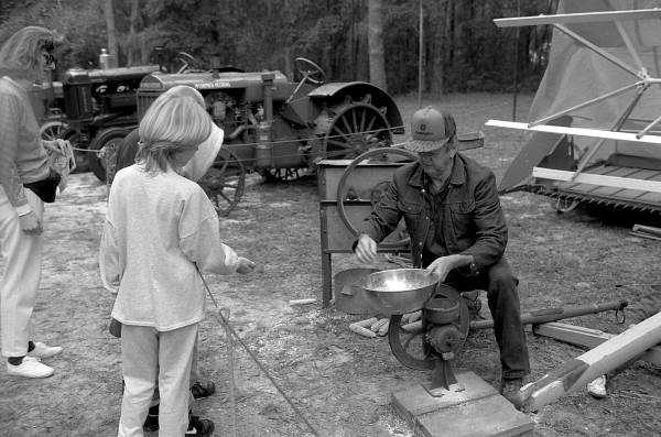 Lee Erixton demonstrating corn grinding - White Springs, Florida