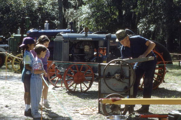 Lee Erixton demonstrating corn shelling - White Springs, Florida
