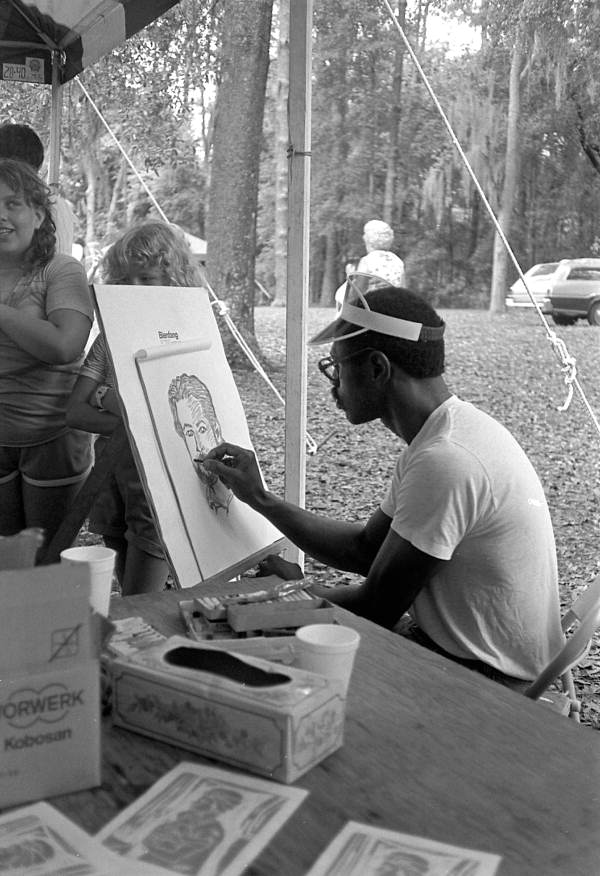 Artist Ellis Wright drawing a portrait at the 1984 Florida Folk Festival - White Springs, Florida