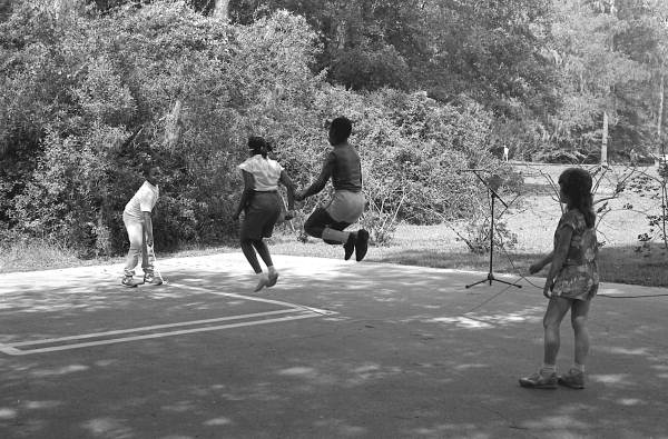 Children playing jump rope in the Children's Folklore Area at the 1985 Florida Folk Festival - White Springs, Florida