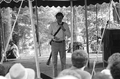 Storyteller and musician Gamble Rogers speaking to audience at the 1987 Florida Folk Festival - White Springs, Florida