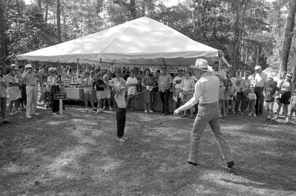 Curly Dekle demonstrating whip cracking at the 1988 Florida Folk Festival - White Springs, Florida