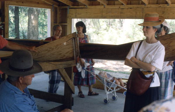 Glen Simmons, left, displaying his Everglades skiffs at the 1992 Florida Folk Festival - White Springs, Florida.
