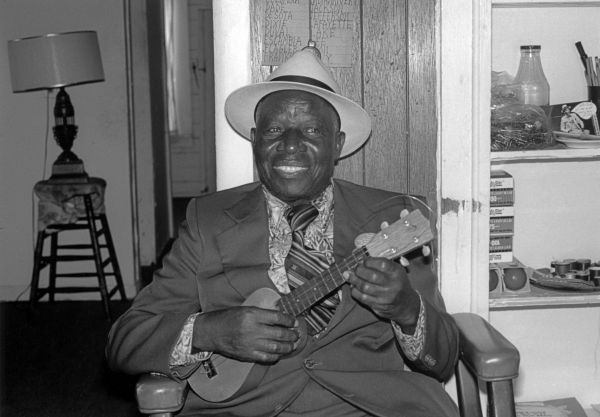 William "Washboard Bill" Cooke poses with his ukulele