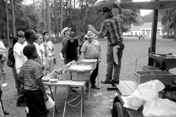 Richard Anderson explains grist milling during Rural Folklife Days demonstrations - White Springs, Florida