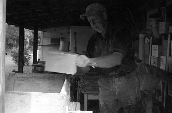 S. M. Blackman emptying corn meal after milling - McAlpin, Florida