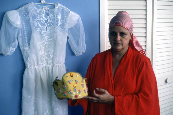 Carmen Pla showing dress and Santeria headpiece she made - Miami Beach, Florida.