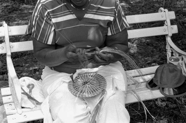 Margaret Garrison weaving a sweetgrass basket- White Springs, Florida