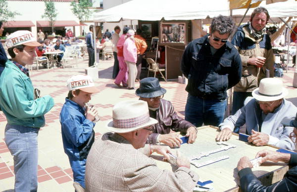 Men playing dominoes at the Traditions Festival - Miami, Florida.