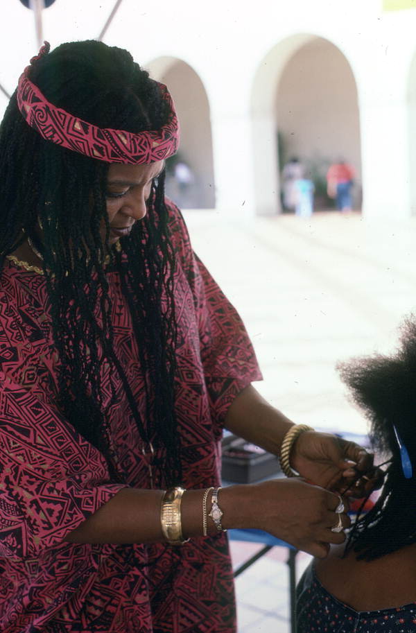 Theola Bright braiding hair at the Traditions Festival - Miami, Florida.