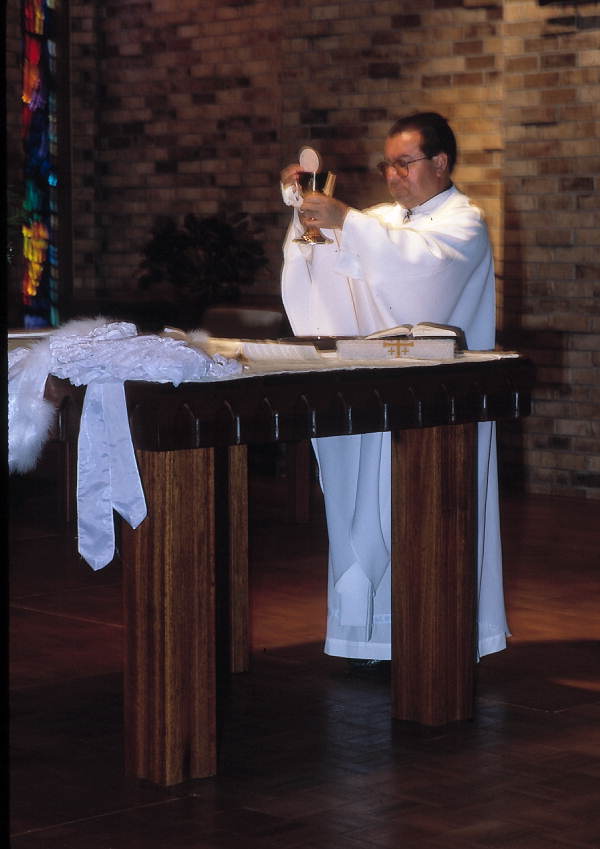 Priest holding a Quinceanera mass - Apopka, Florida