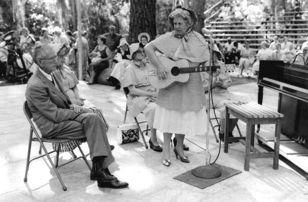 Mrs. L.M. Wilson of O'Brien playing guitar- White Springs, Florida