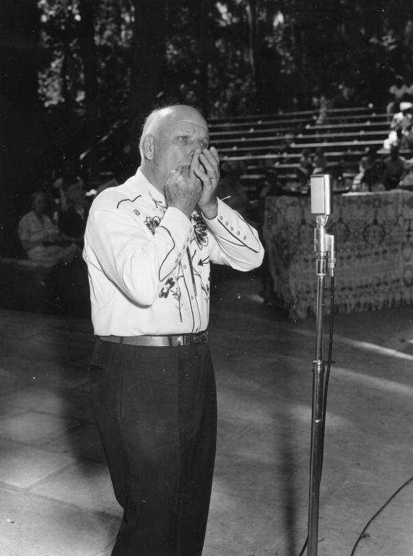 Jack Parker, of Orlando, whistling with his hands- White Springs, Florida