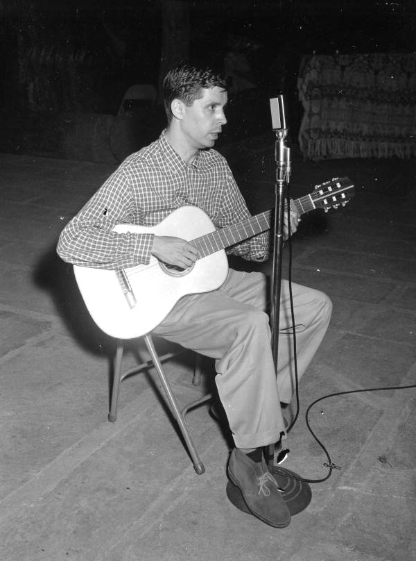 Jay Smith of Jacksonville playing guitar at the 1959 Florida Folk Festival- White Springs, Florida