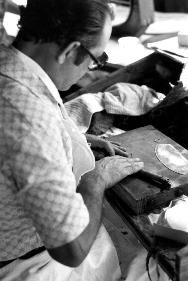 Pedro Gomez rolling a cigar