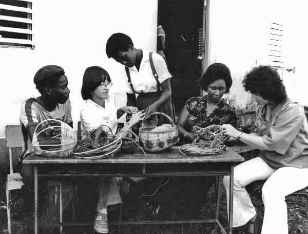 Folklorists Merri Belland and Peggy Bulger lead a weaving class in Jamaica- Jamaica