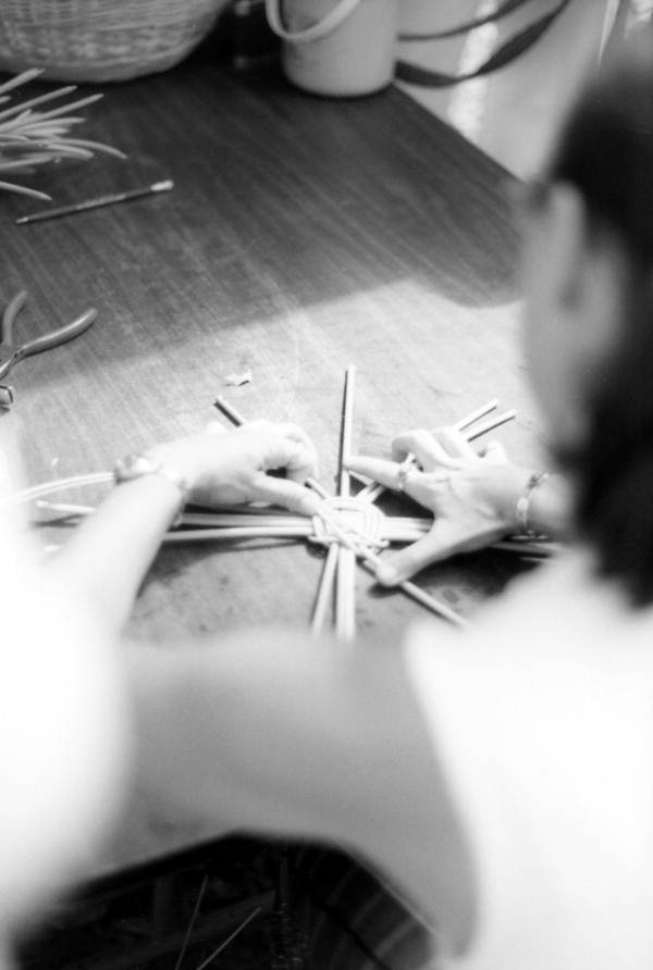 Participant in a basketry workshop making a basket at the July 4th Celebration- White Springs, Florida
