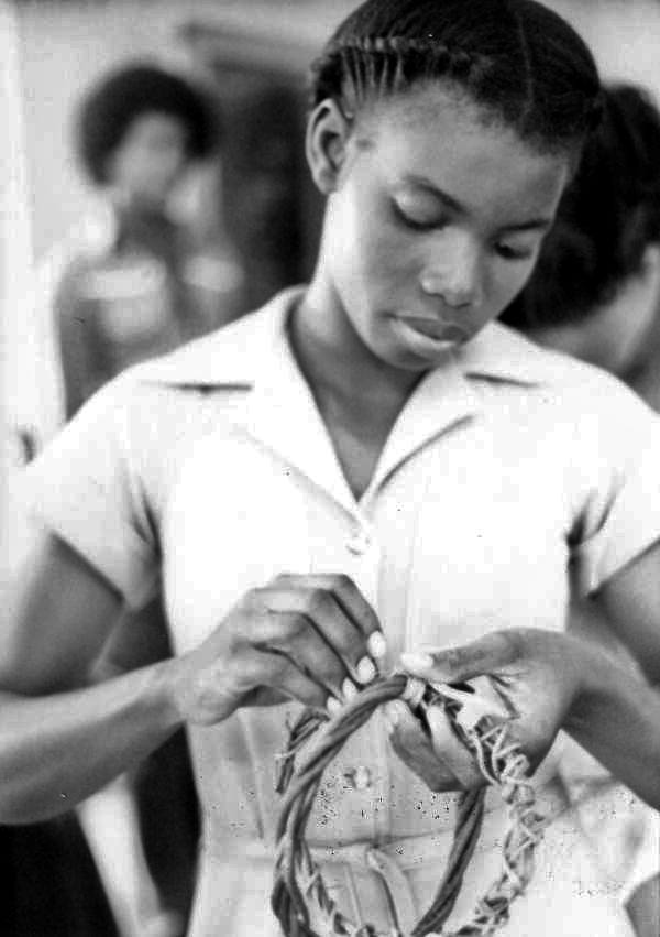 Jamaican girl participating in Merri Belland's basket weaving class- Jamaica