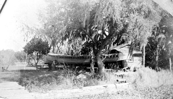 Will Newman working on a tugboat hull in the front yard - East Palatka, Florida.