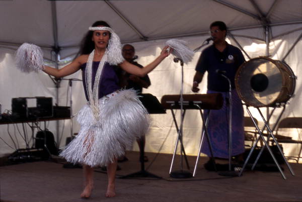 Kaleinani Ohumukini dances while Henry Ohumukini and James Buchin plays at Florida Folklife Festival - White Springs, Florida.