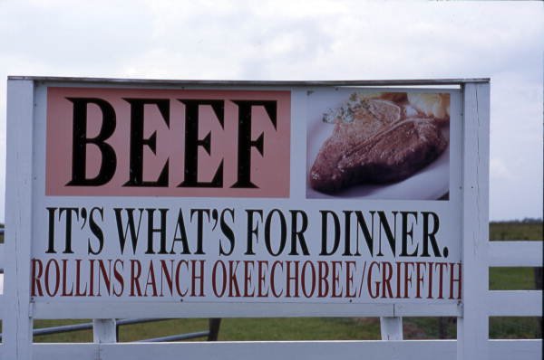 Sign advertising beef for Rollins Ranch near Okeechobee