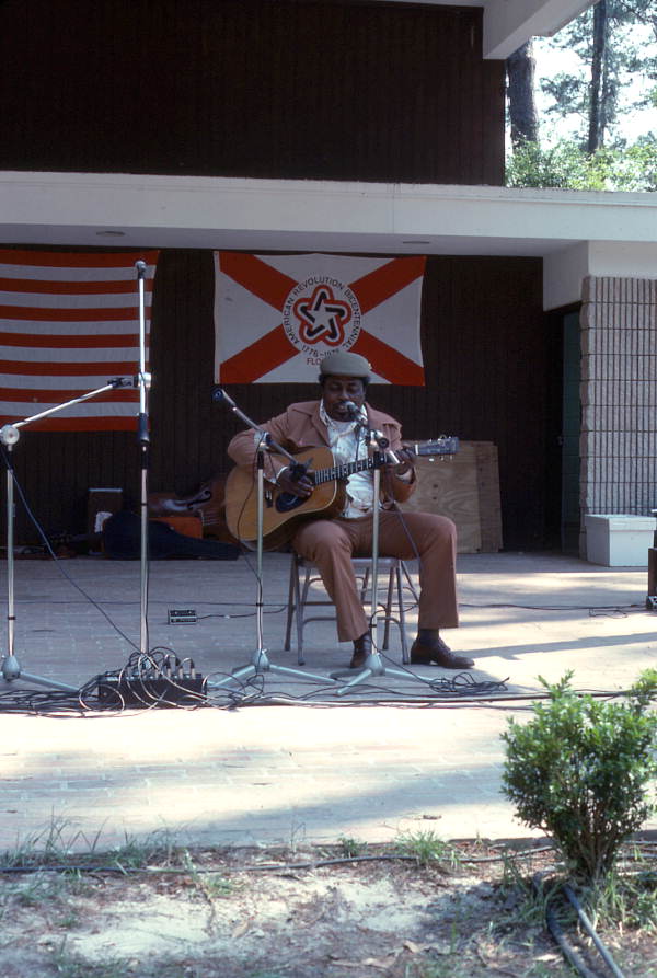 Blues legend Johnny Shines playing guitar on the main stage at the Portable Folk Festival - White Springs, Florida