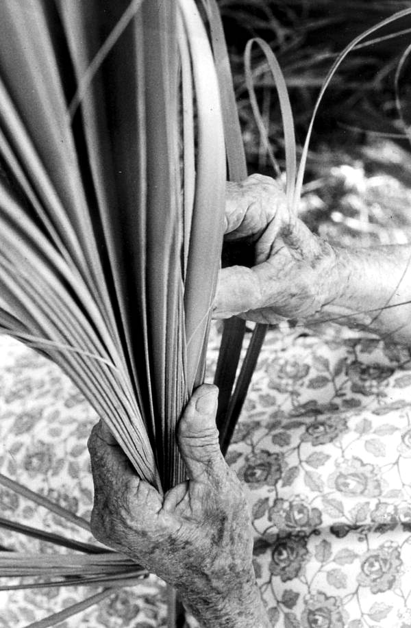 Palmetto weaving being performed by Pearlie Gates