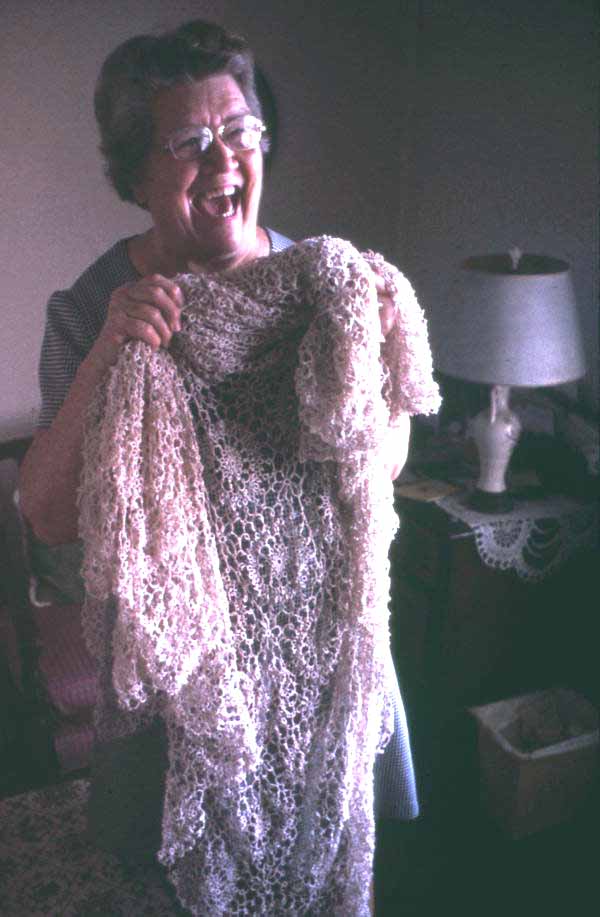 Mildred Rivers holding up an example of her tatting- Lake Butler, Florida